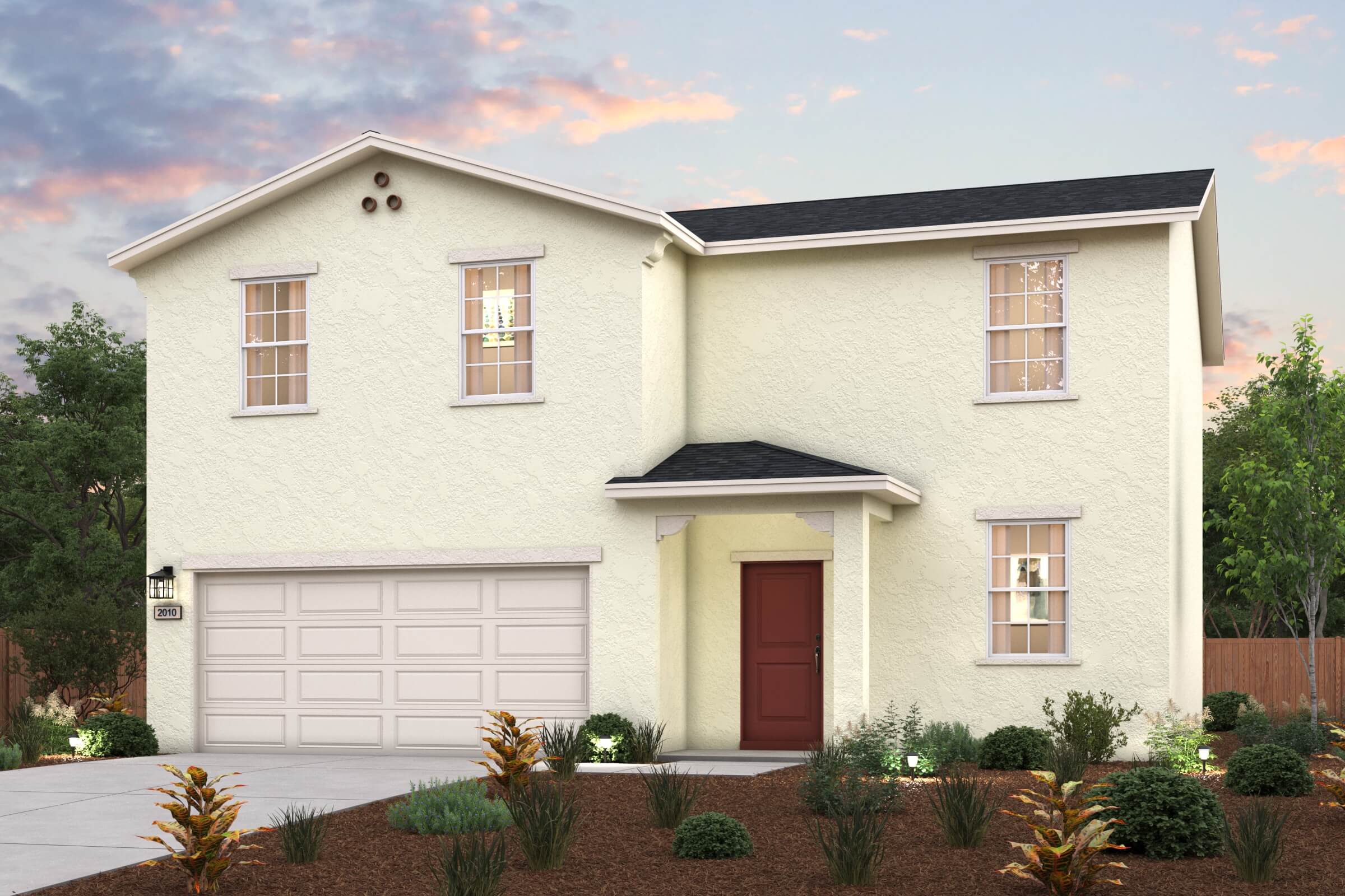 A white house with a garage.