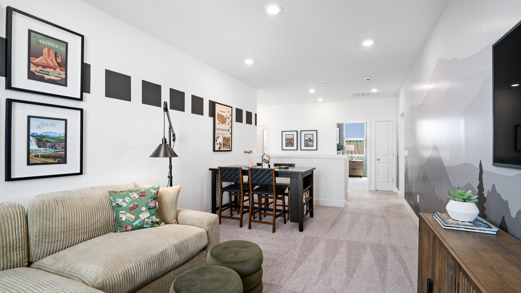 A room with a couch and a table.