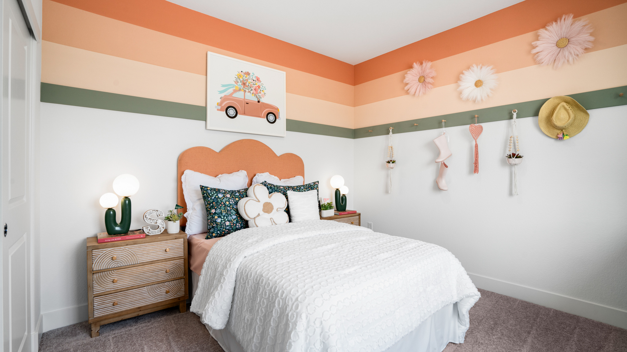 A bedroom with a bed and a dresser.