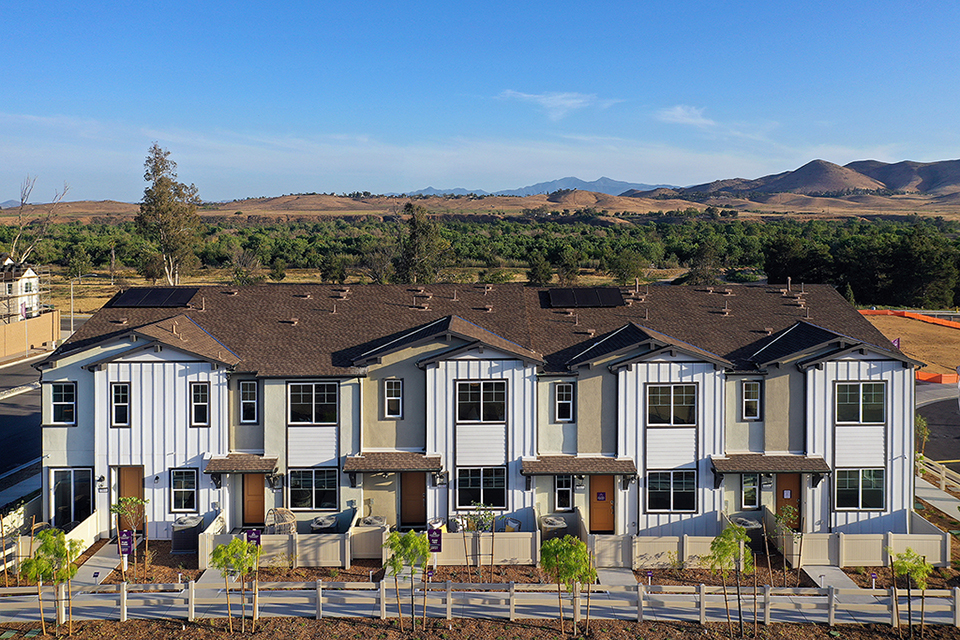 A large house with a fence around it.