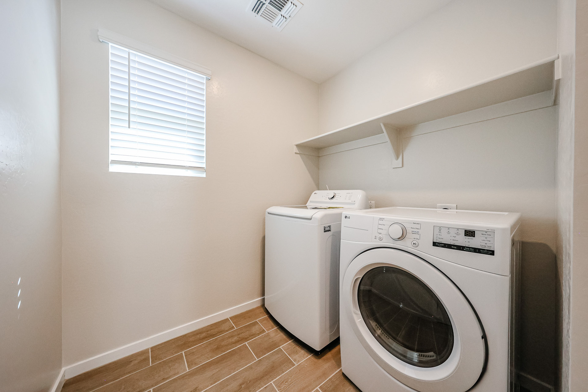 A washing machine in a room.