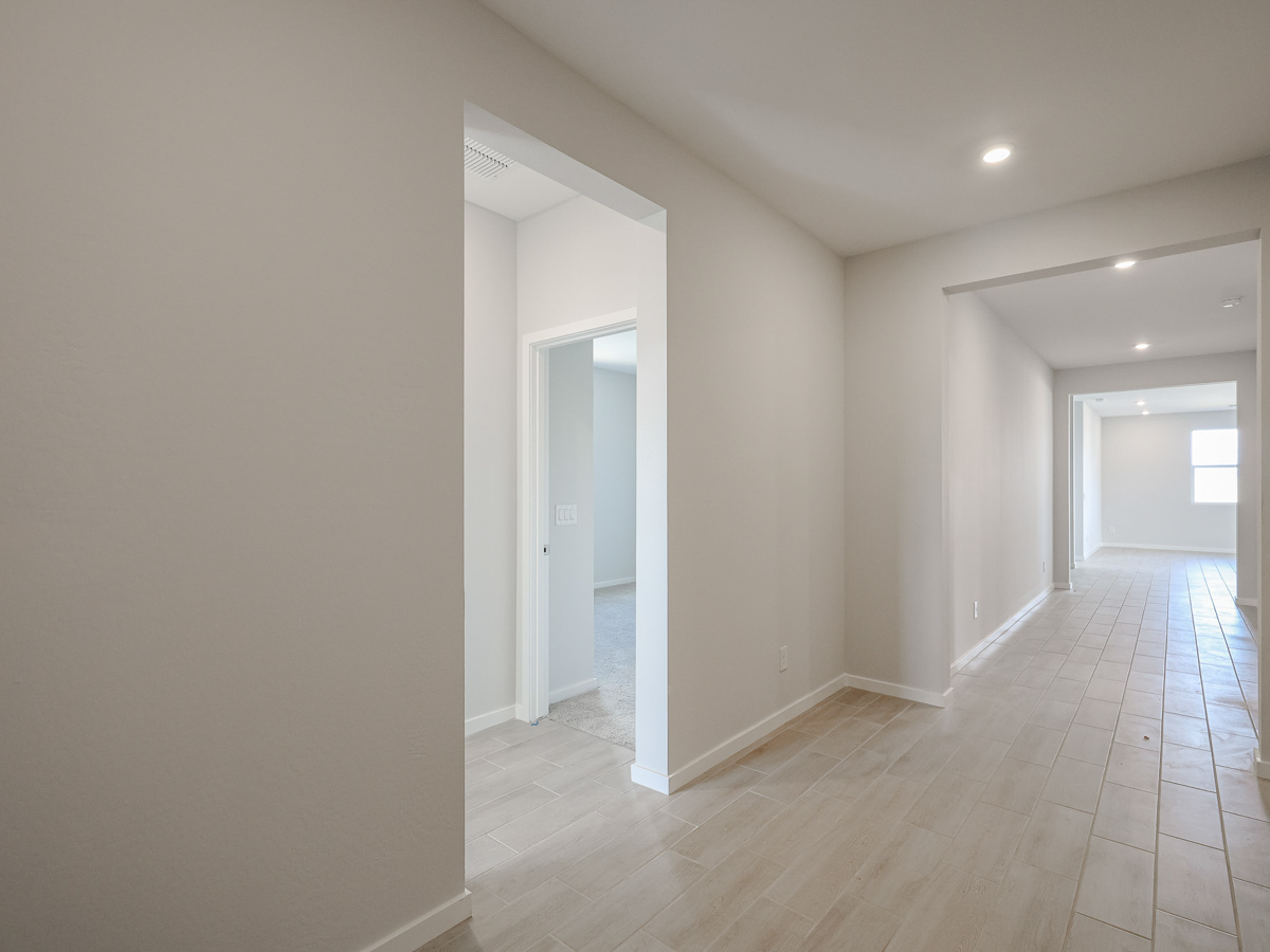 A hallway with white walls.