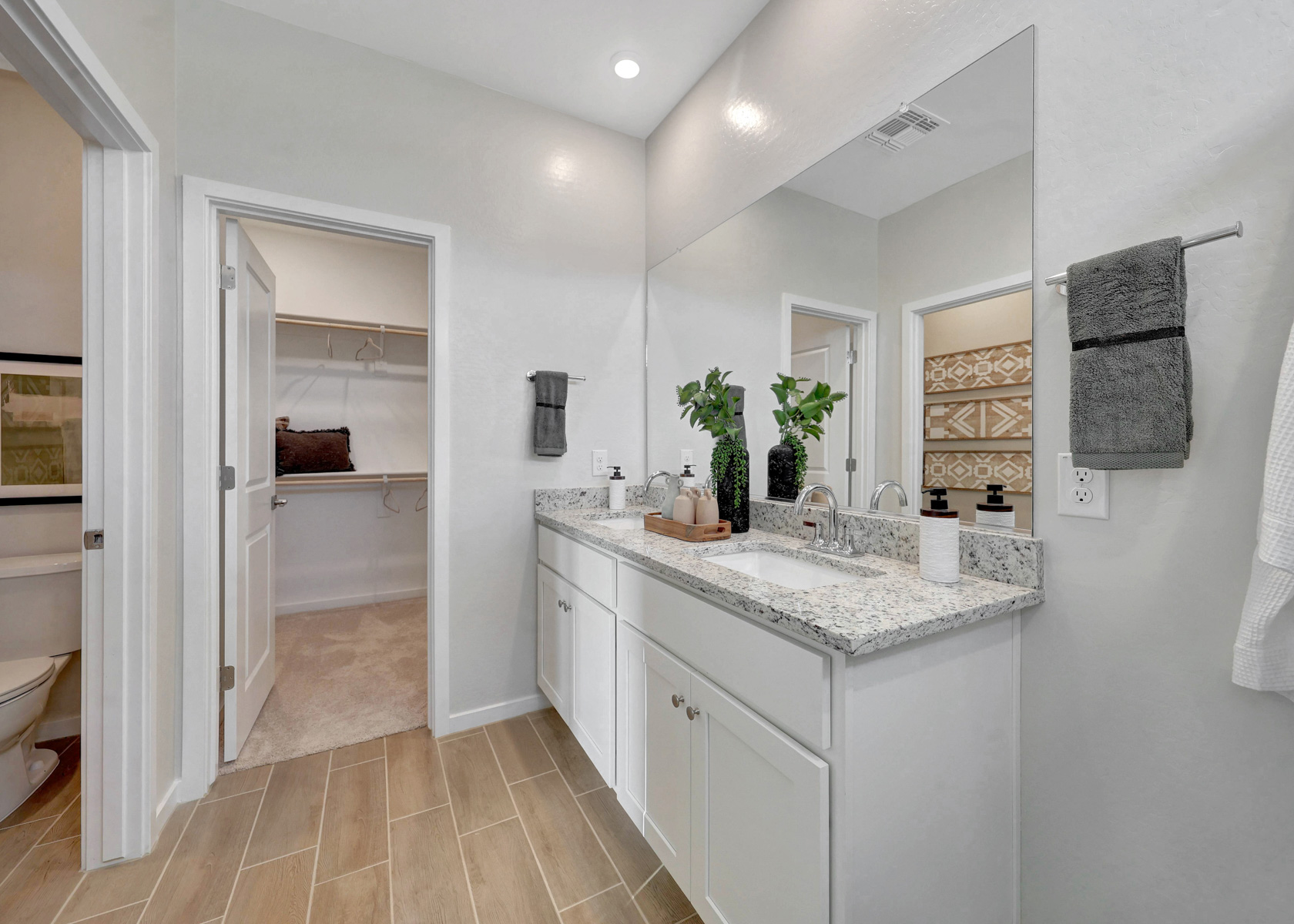 A bathroom with a marble countertop.