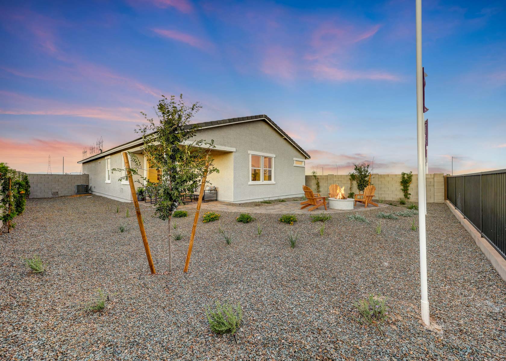 A house with a tree in the front yard.