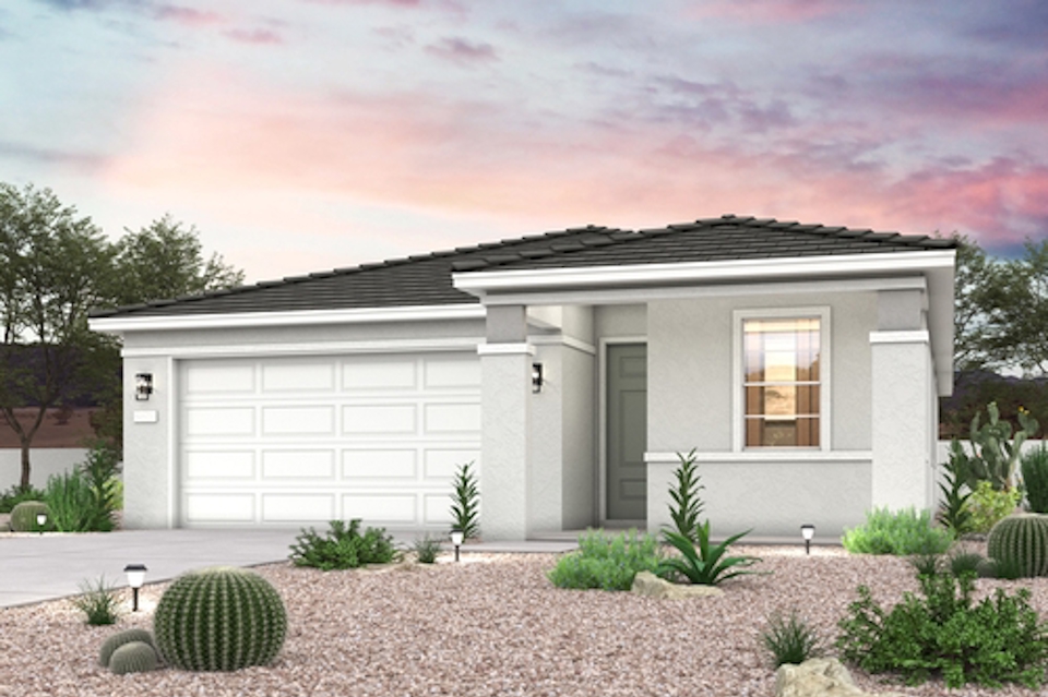 A house with a gravel driveway.