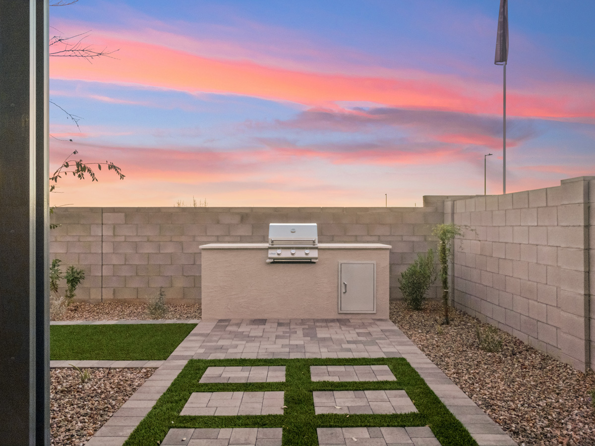 A brick wall with a rectangular white box on top of it.