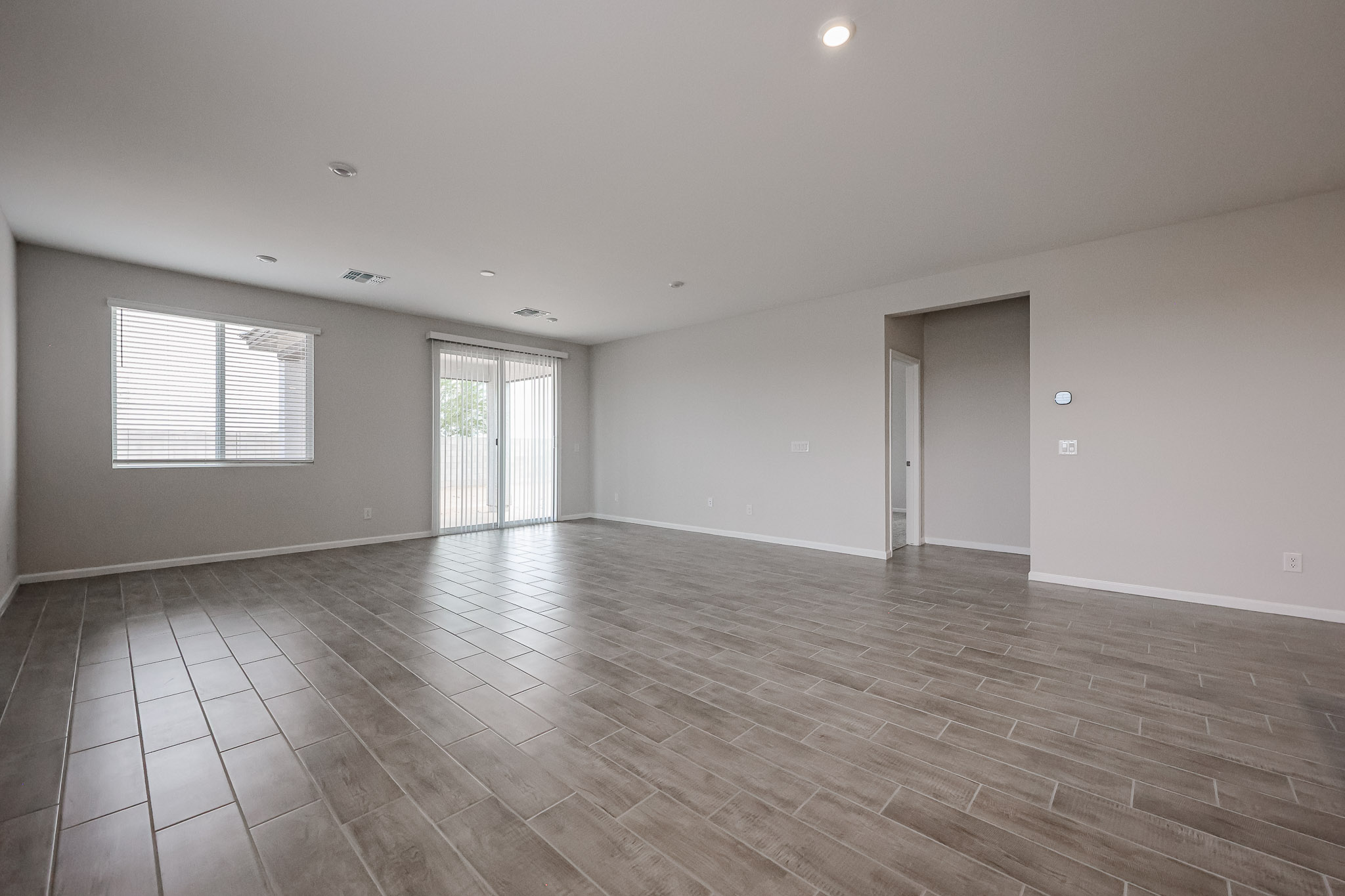 A room with a wood floor and a wood floor.