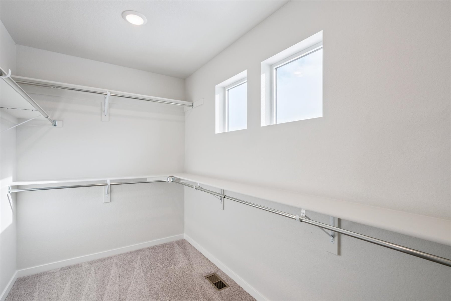 A white room with a staircase.