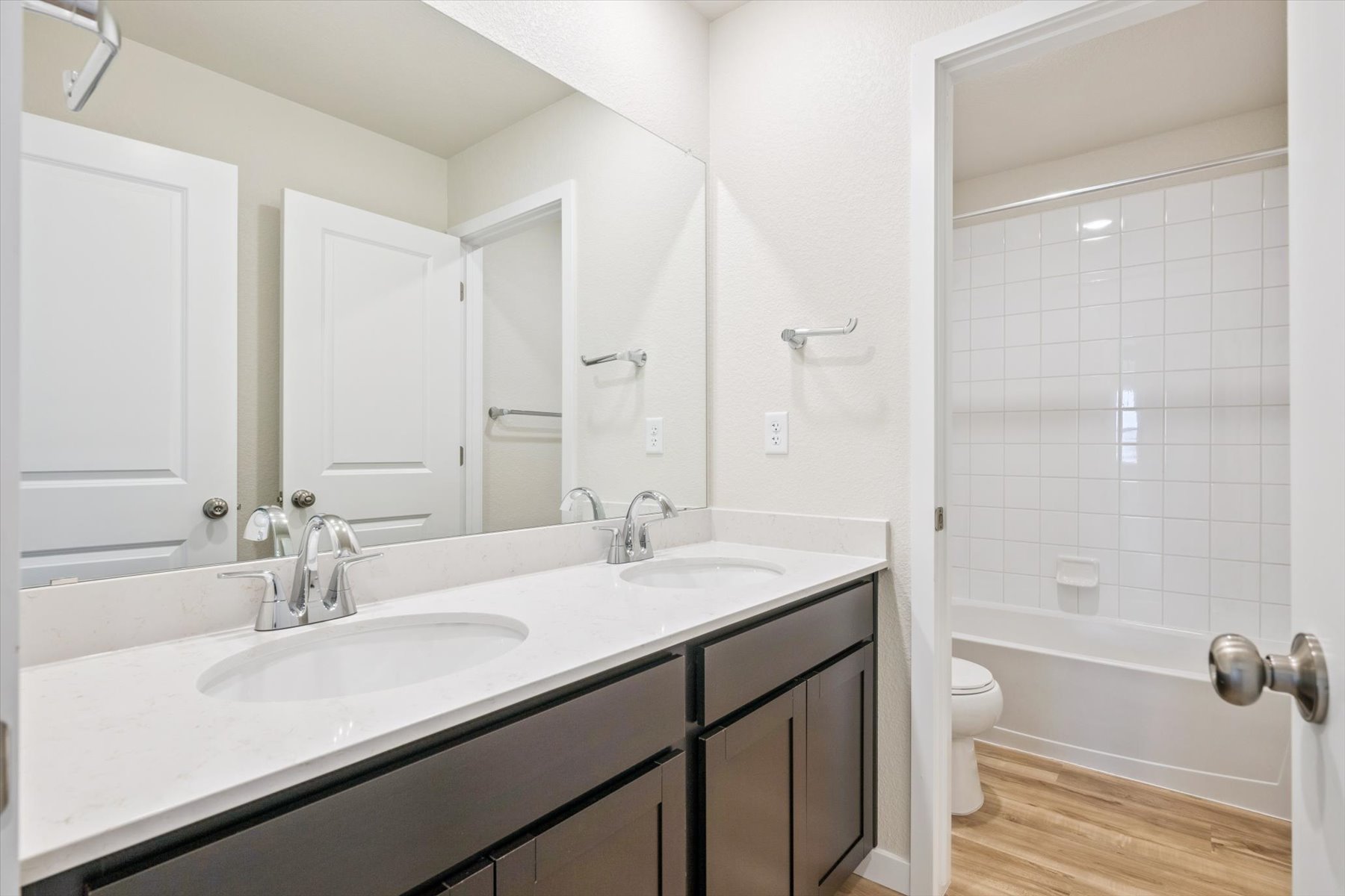 A bathroom with a sink and a toilet.