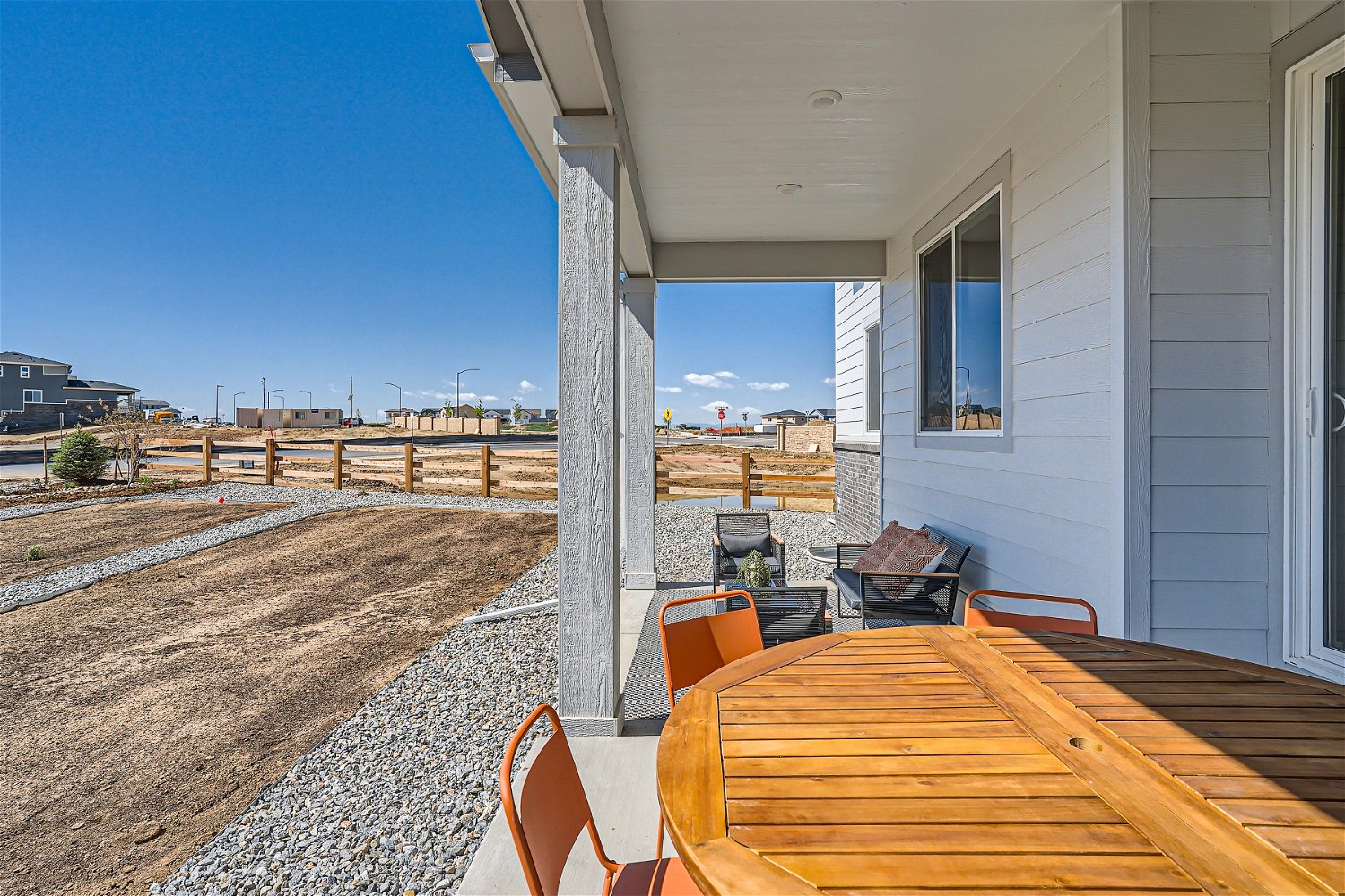 A table and chairs outside a building.