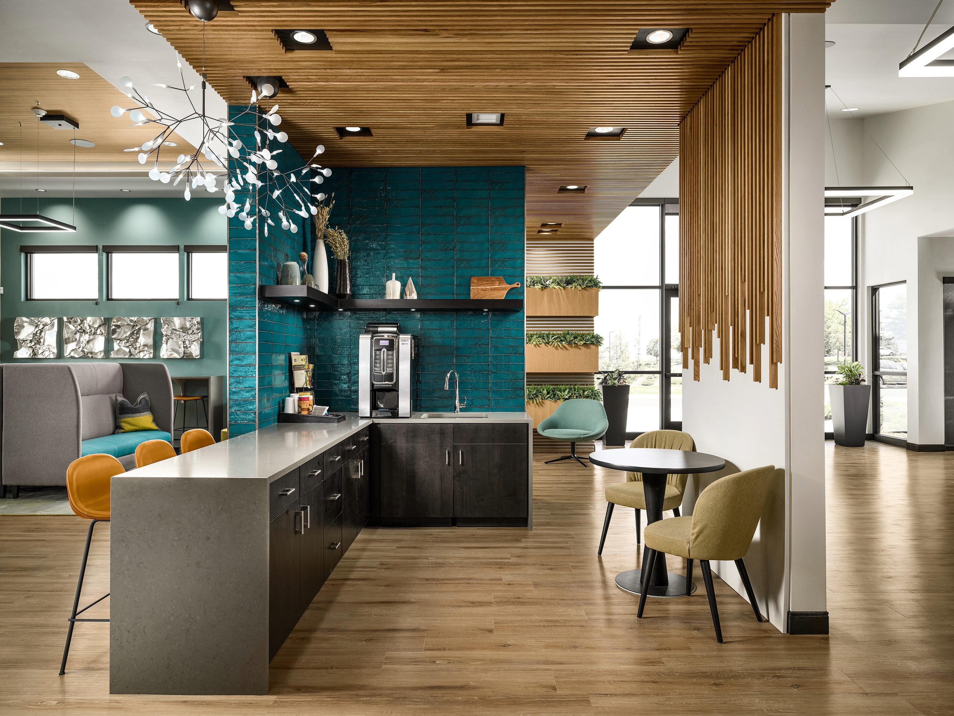 A room with a table chairs and a couch.