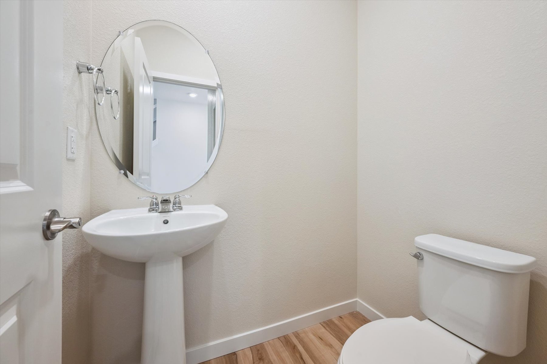 A bathroom with a sink and toilet.