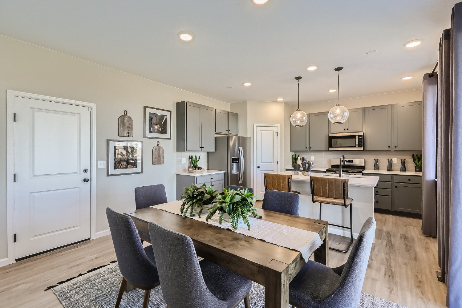 A kitchen with a dining table.