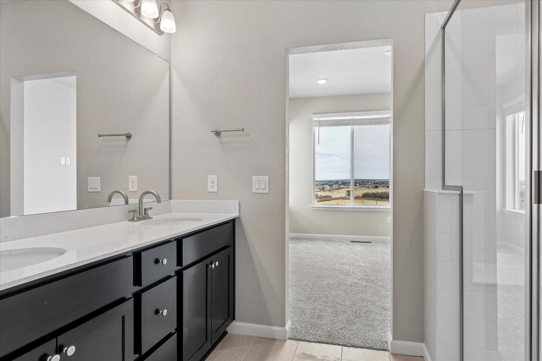 A bathroom with a glass shower.