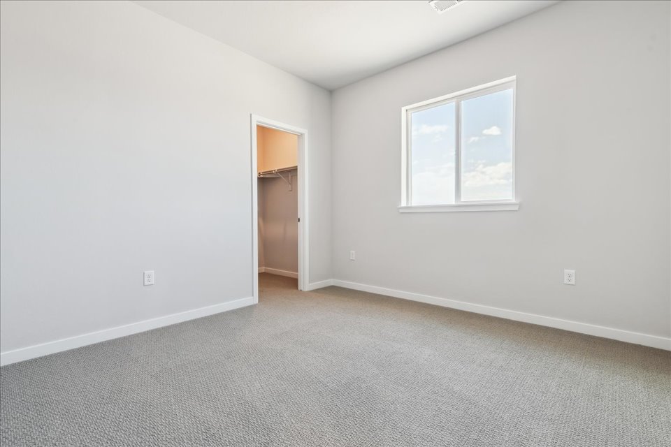 A room with a door and a window.