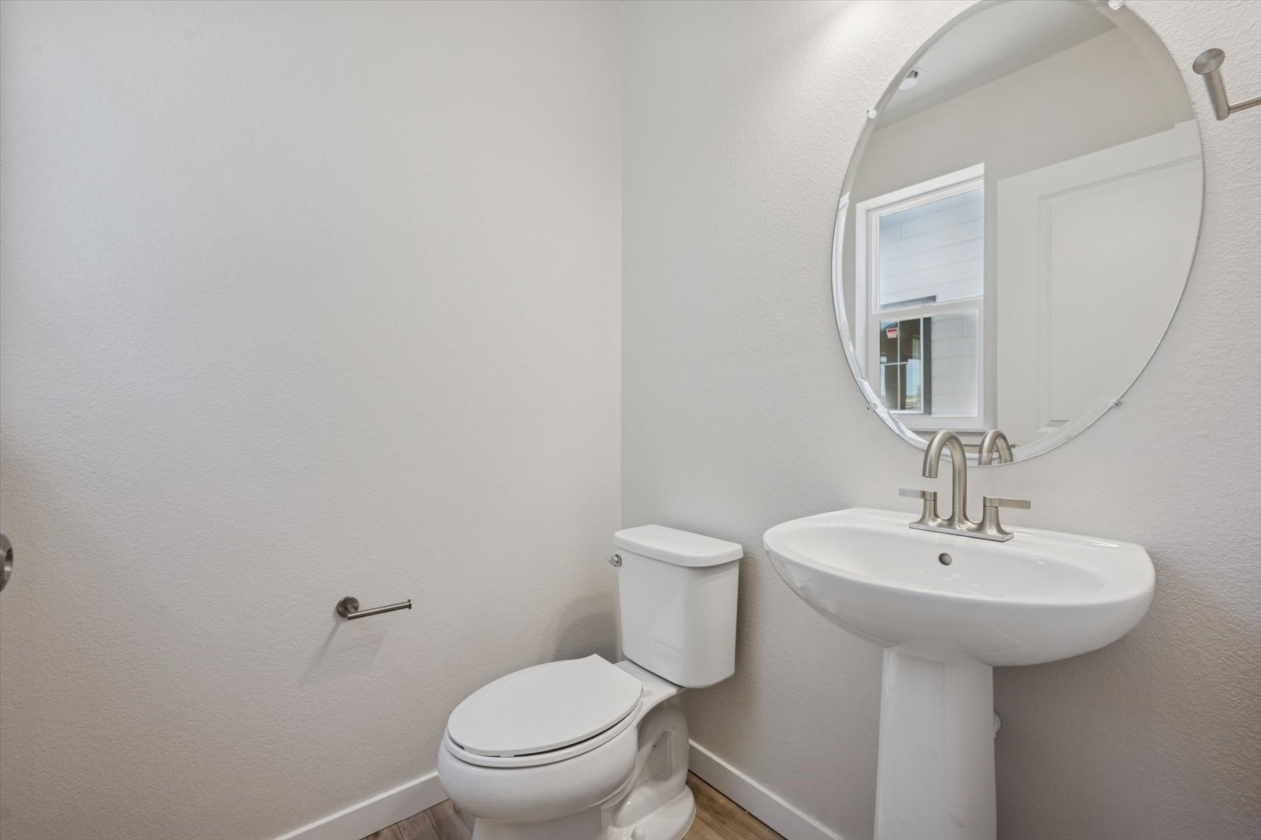 A bathroom with a sink and toilet.