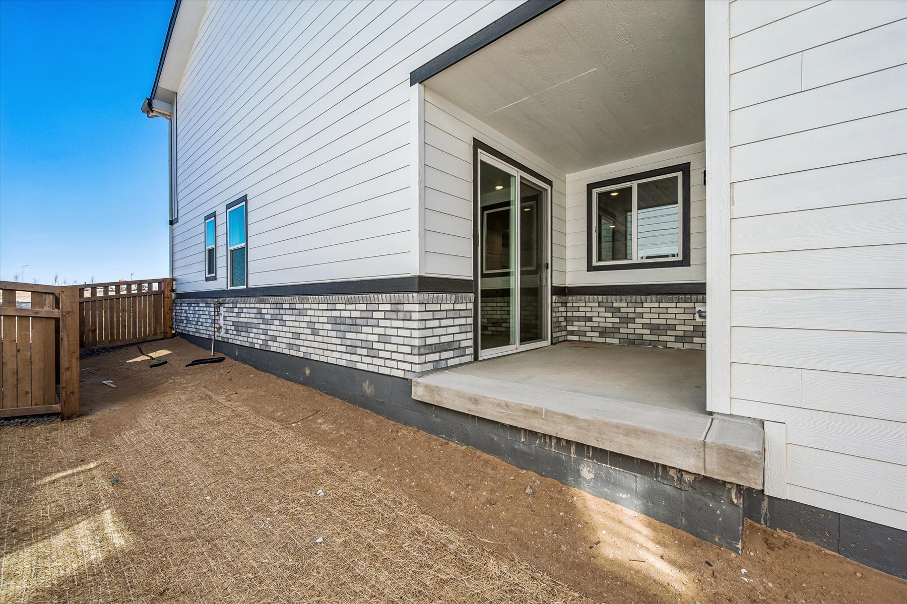 A house with a garage and a fence.