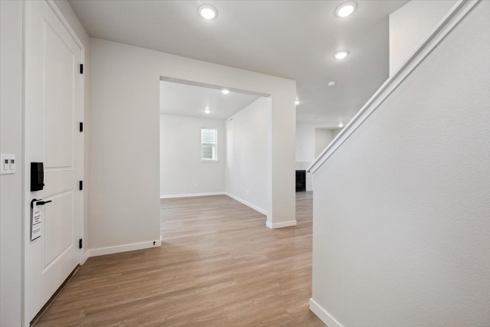 A hallway with white walls.