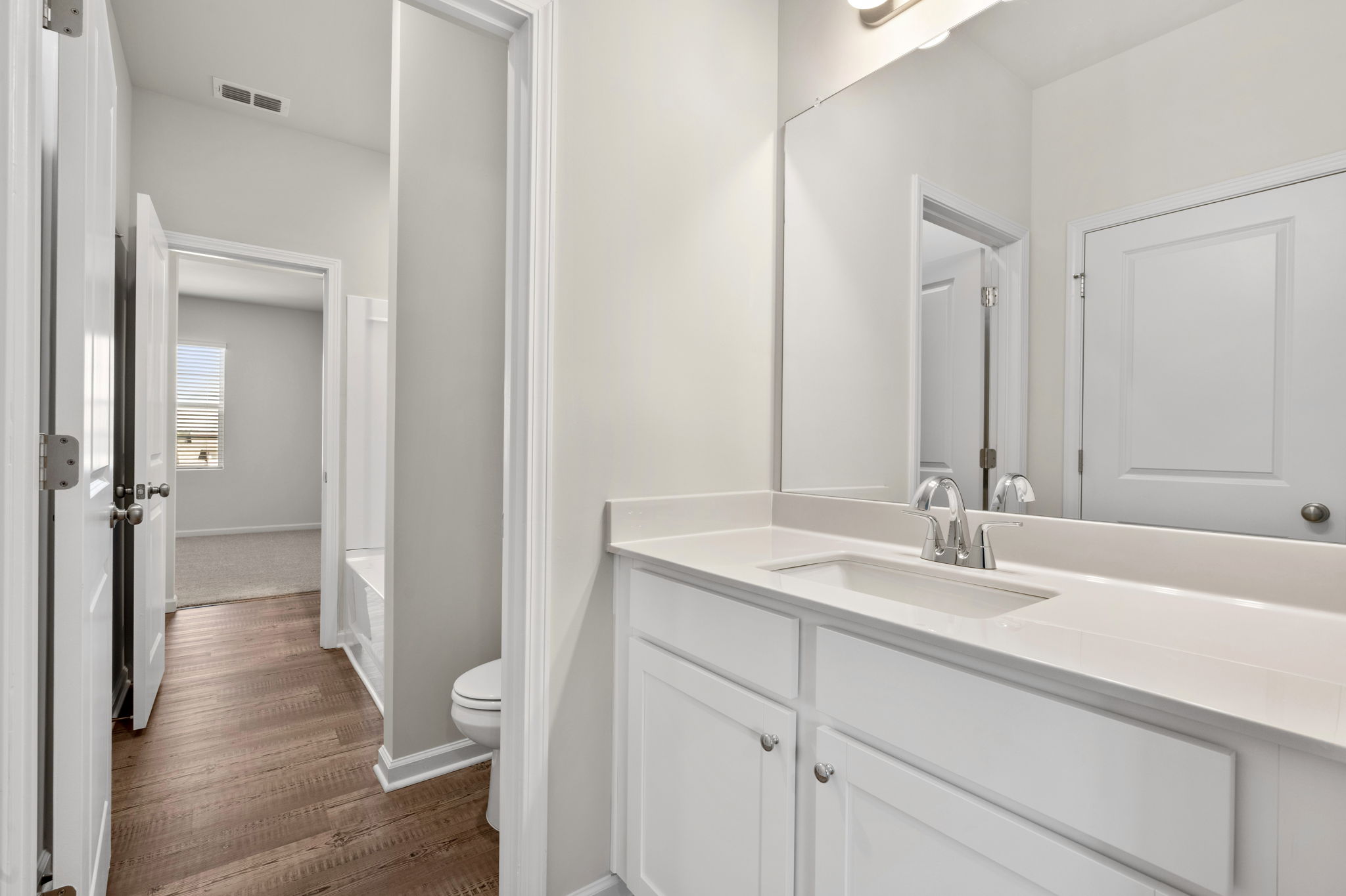A bathroom with a sink and a toilet.
