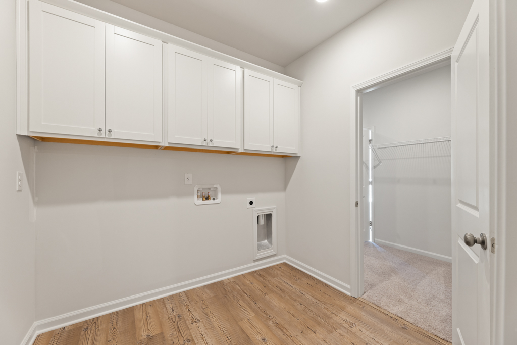 A room with white cabinets.