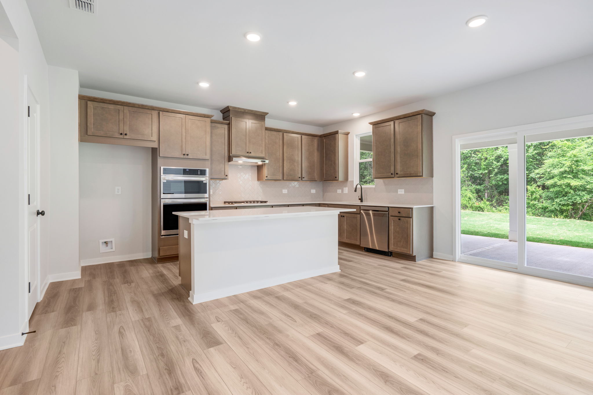 A kitchen with wooden floors.