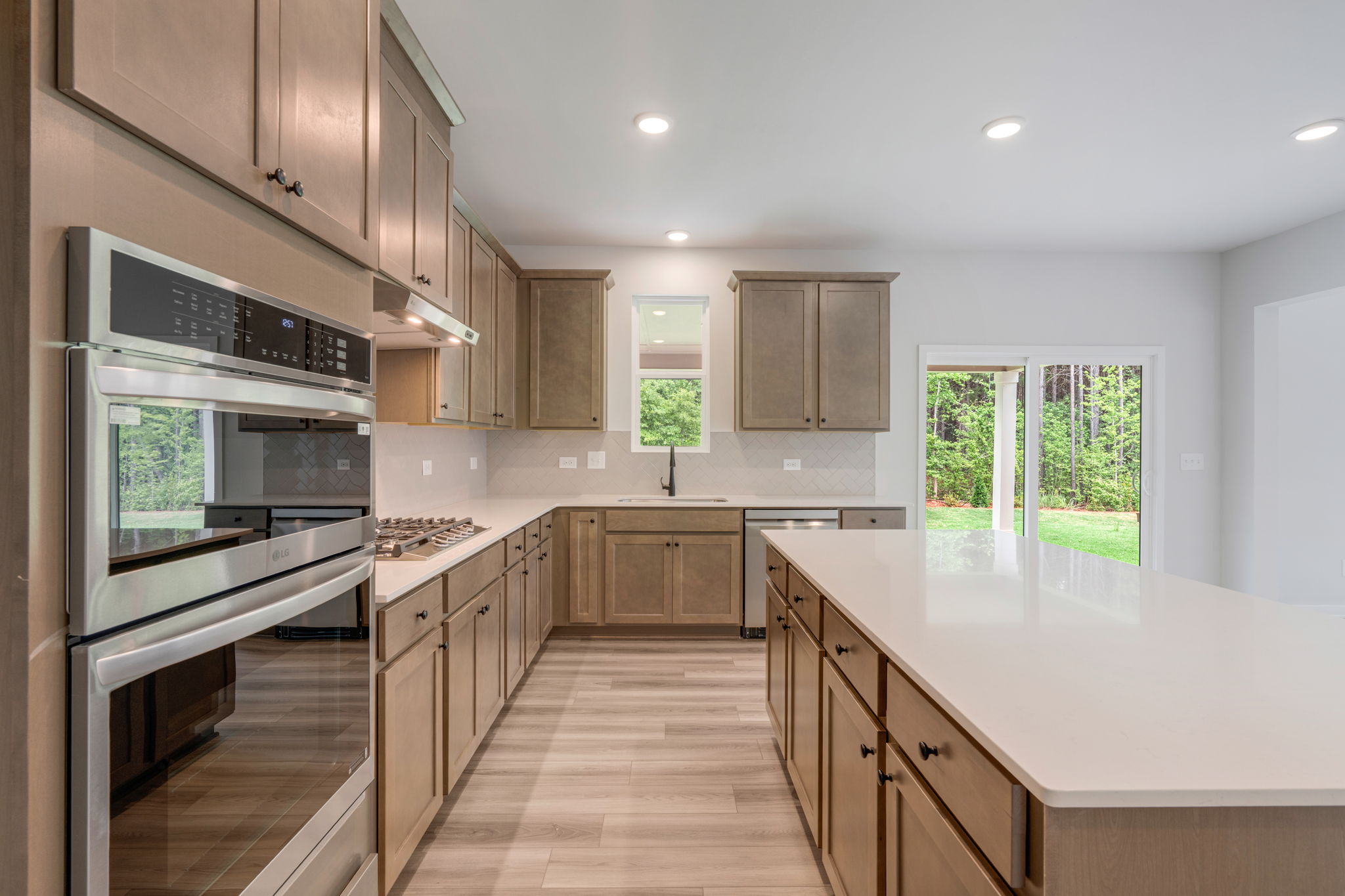 A kitchen with wooden cabinets.