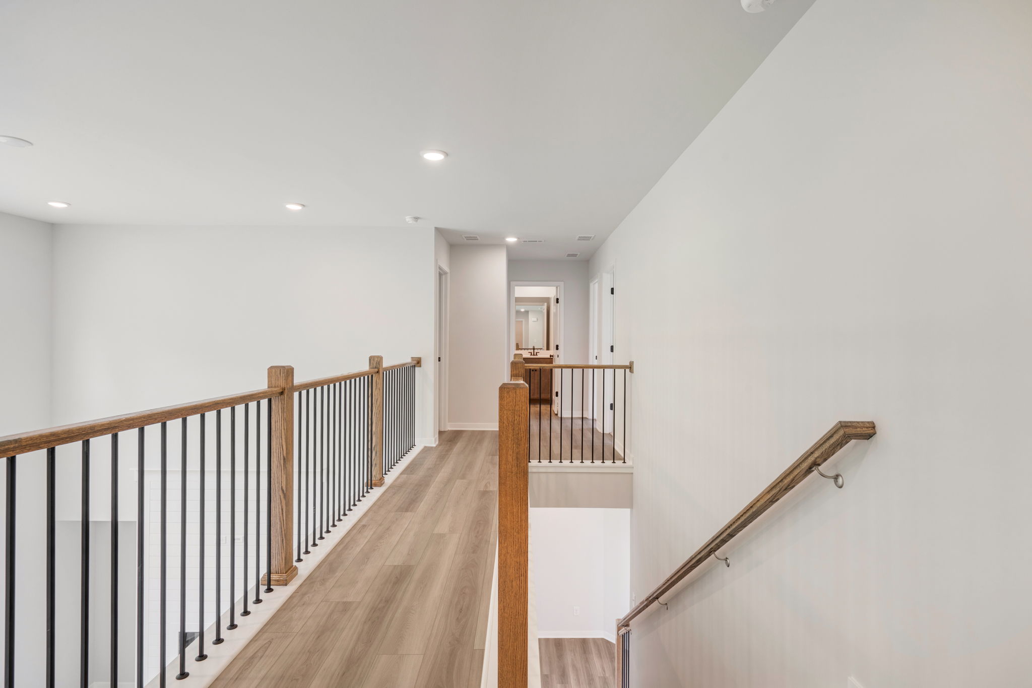 A long hallway with white walls.