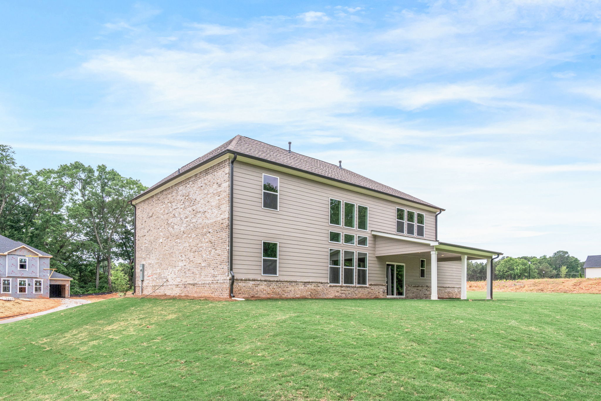 A house with a grass yard.