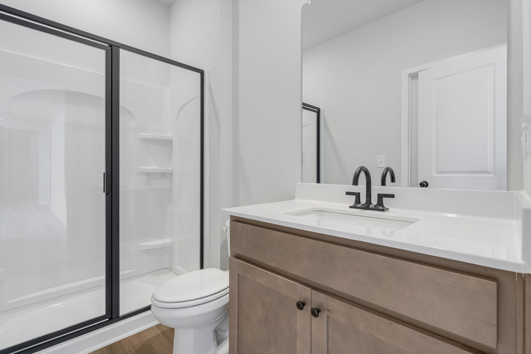 A bathroom with a glass shower.