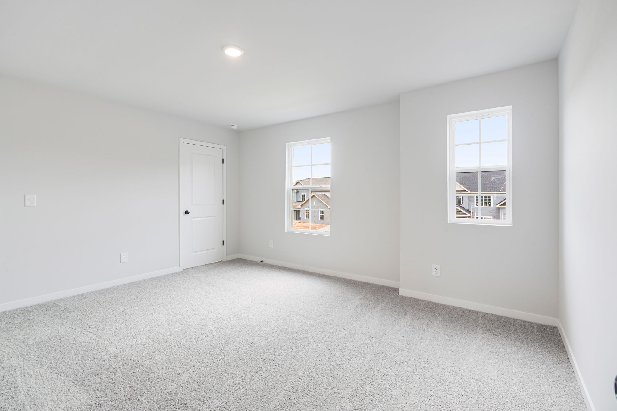 A room with a door and windows.