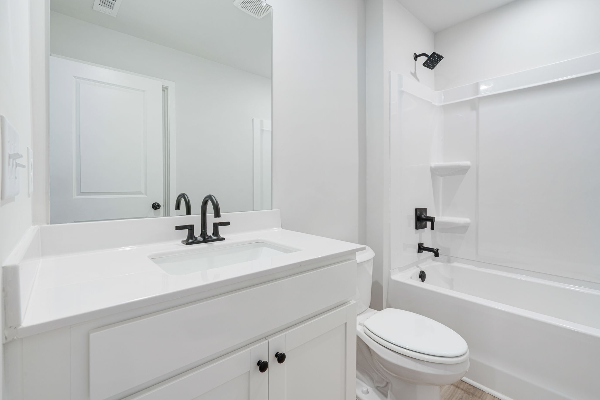 A bathroom with a sink and toilet.