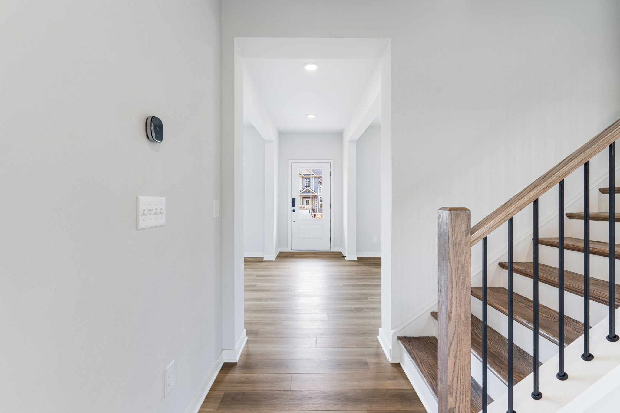 A hallway with white walls.