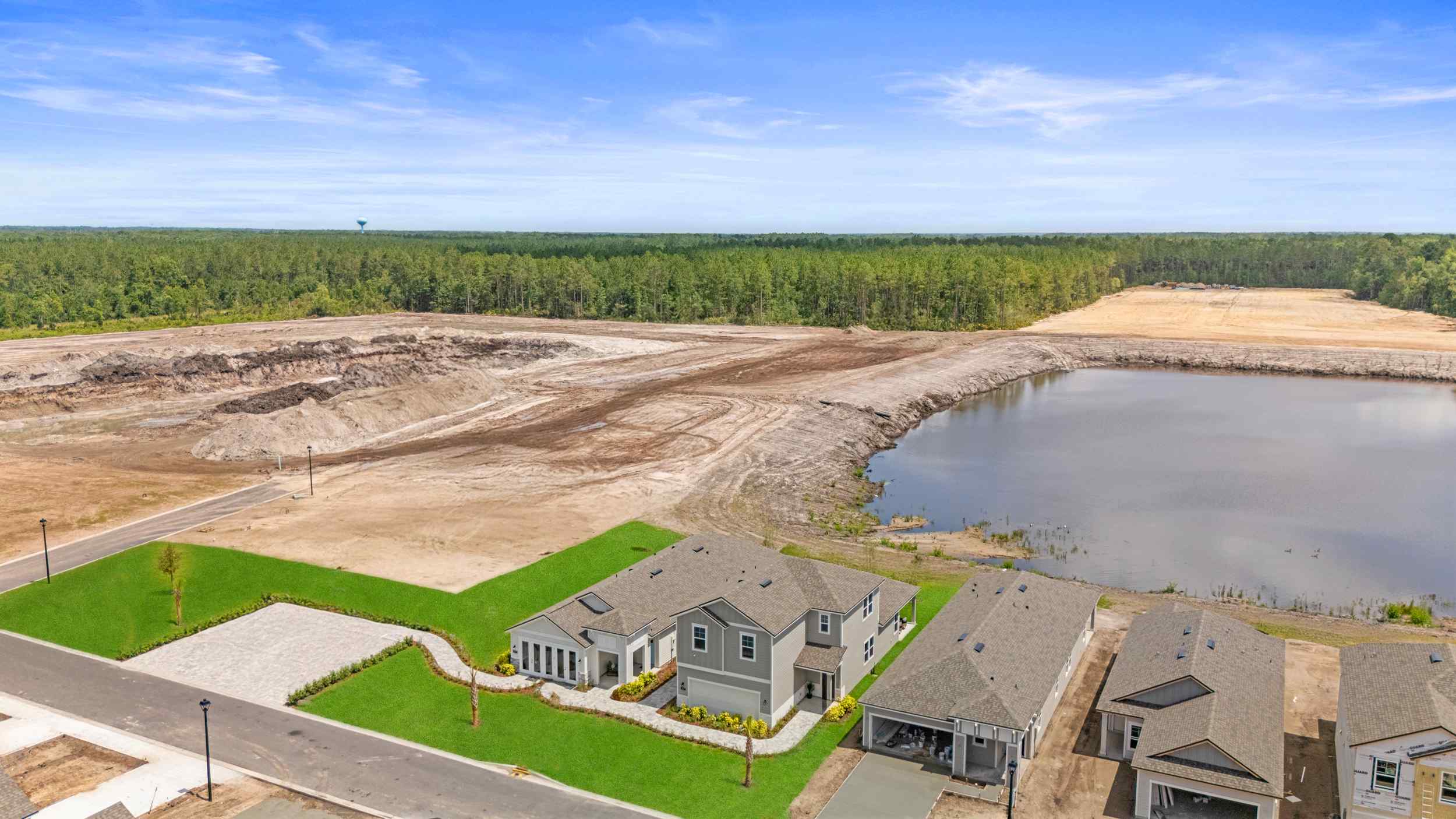 A flooded area with houses and a dam.