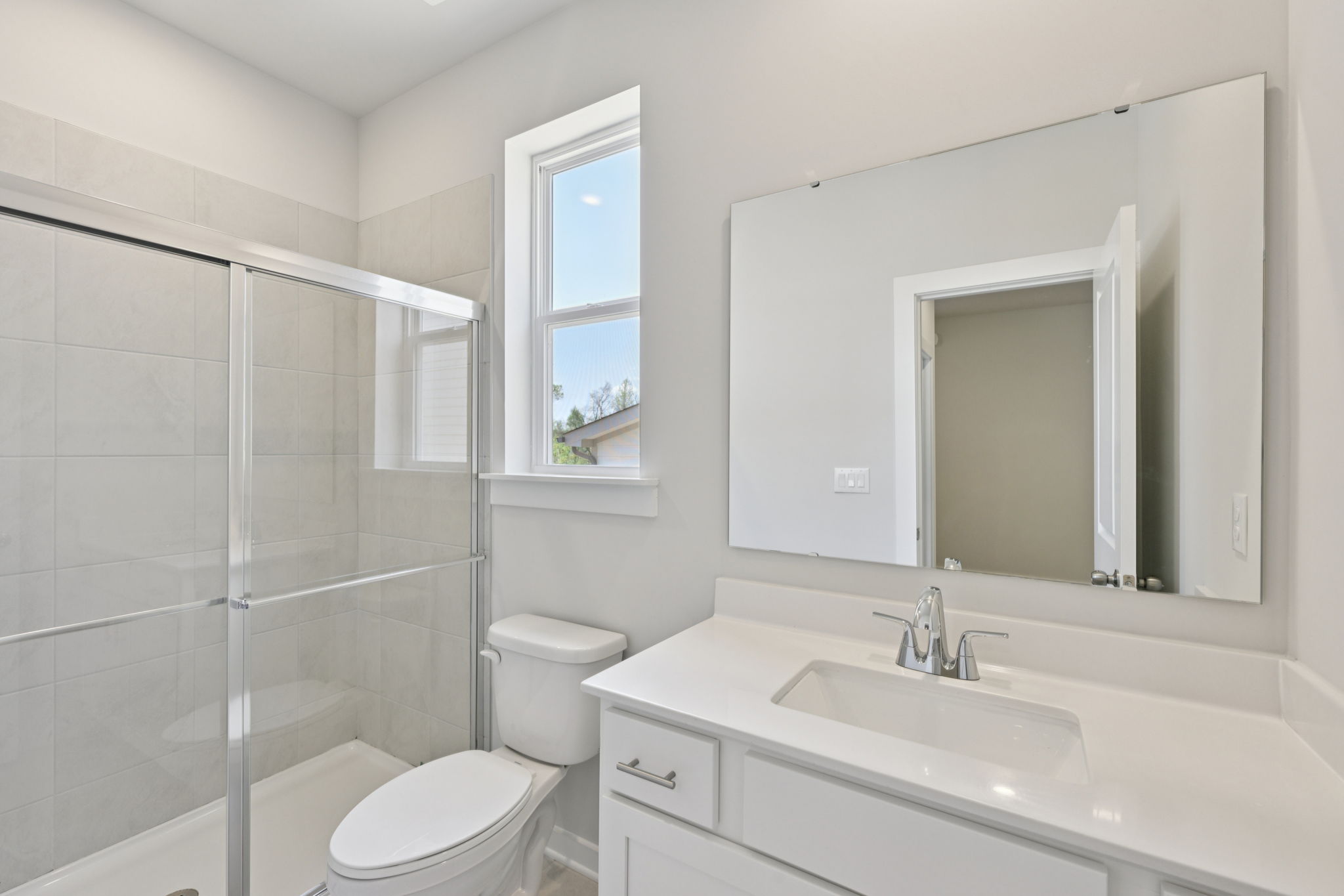 A bathroom with a glass shower.