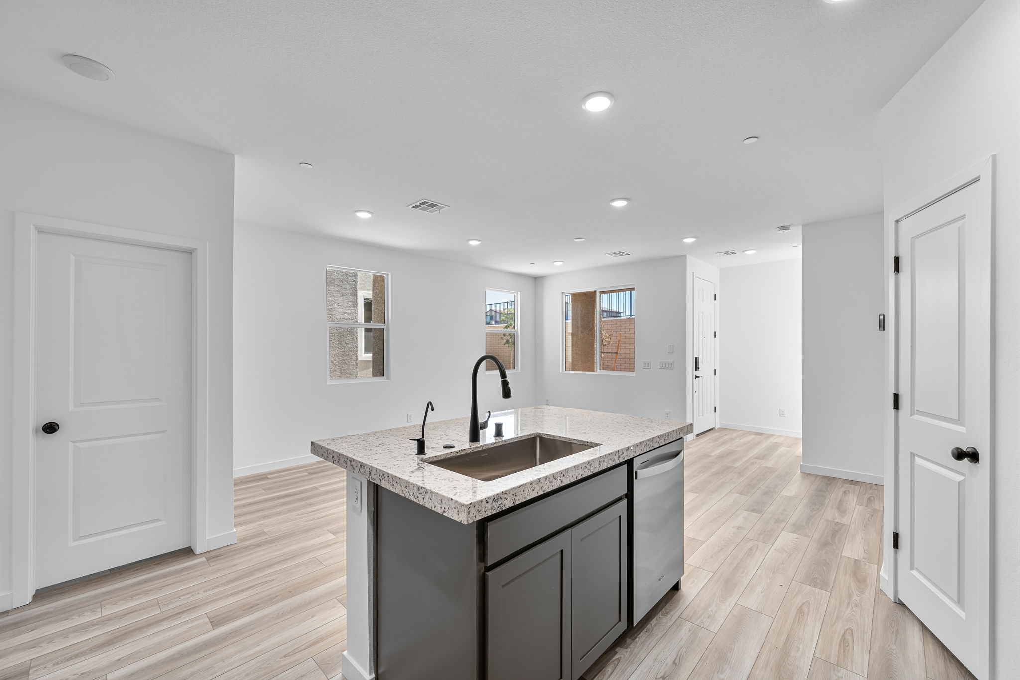 A kitchen with a marble countertop.