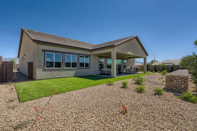 A house with a yard and a fence.