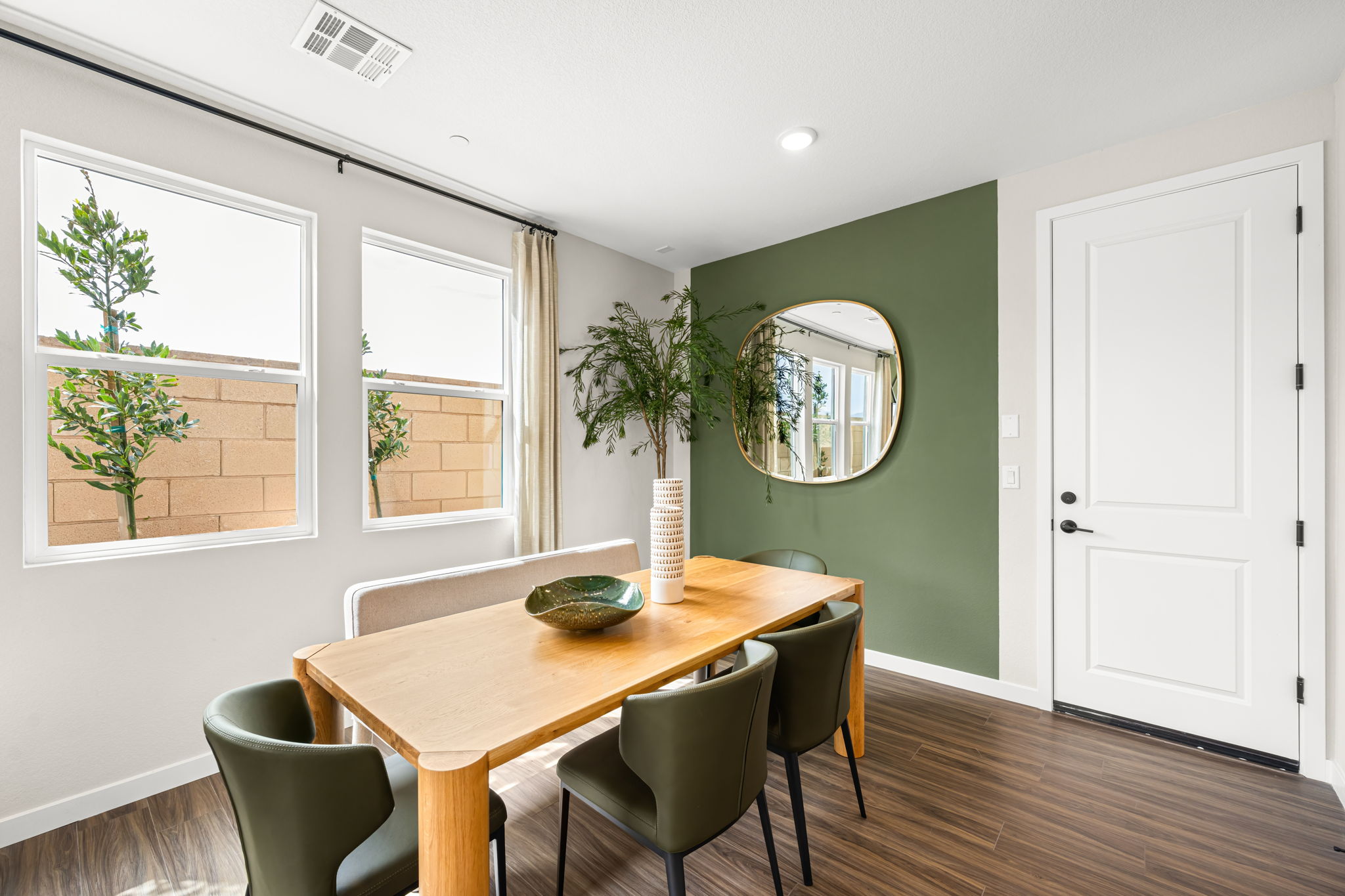 A room with a table and chairs.