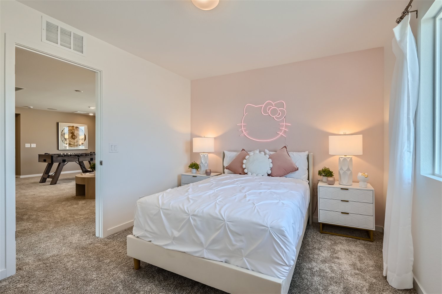 A bedroom with a bed and a desk.