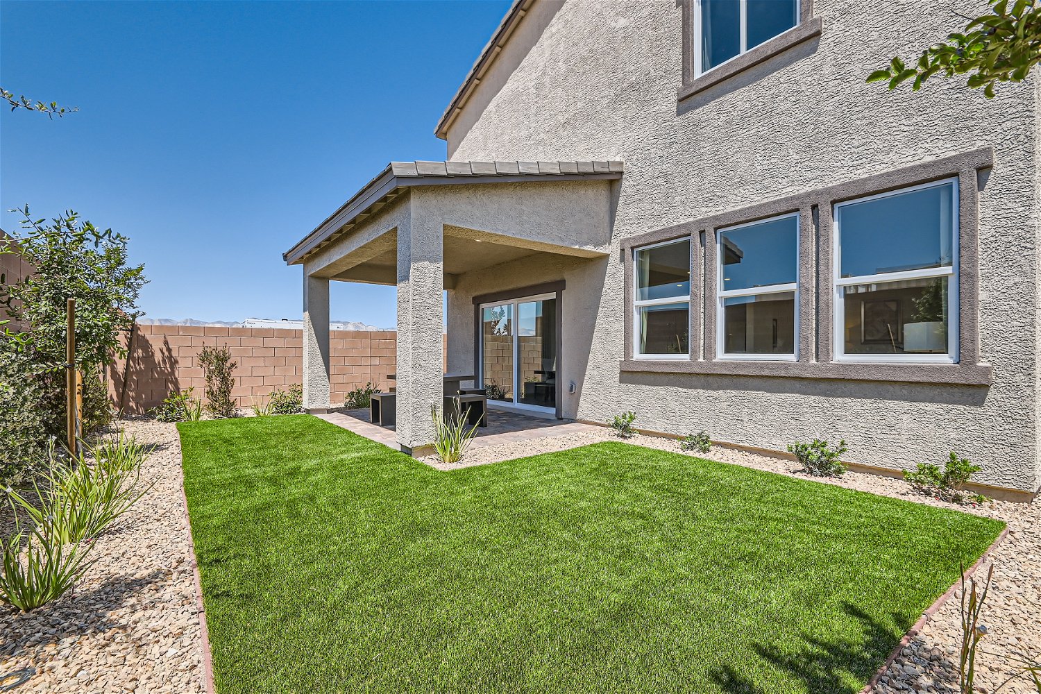A house with a grass yard.