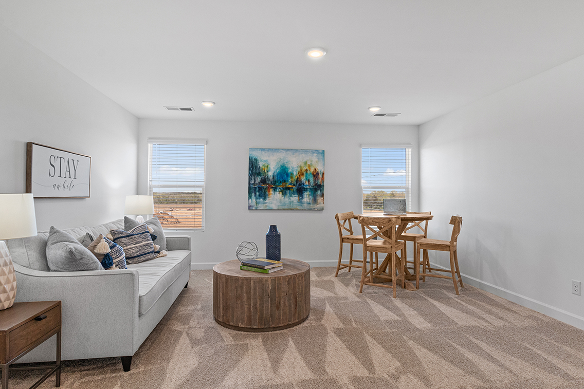 A living room with a couch and a coffee table.
