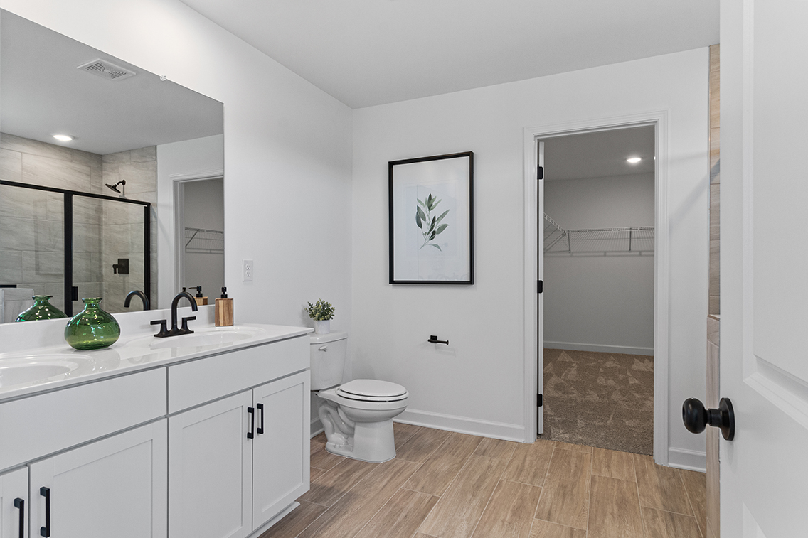 A bathroom with a toilet and sink.