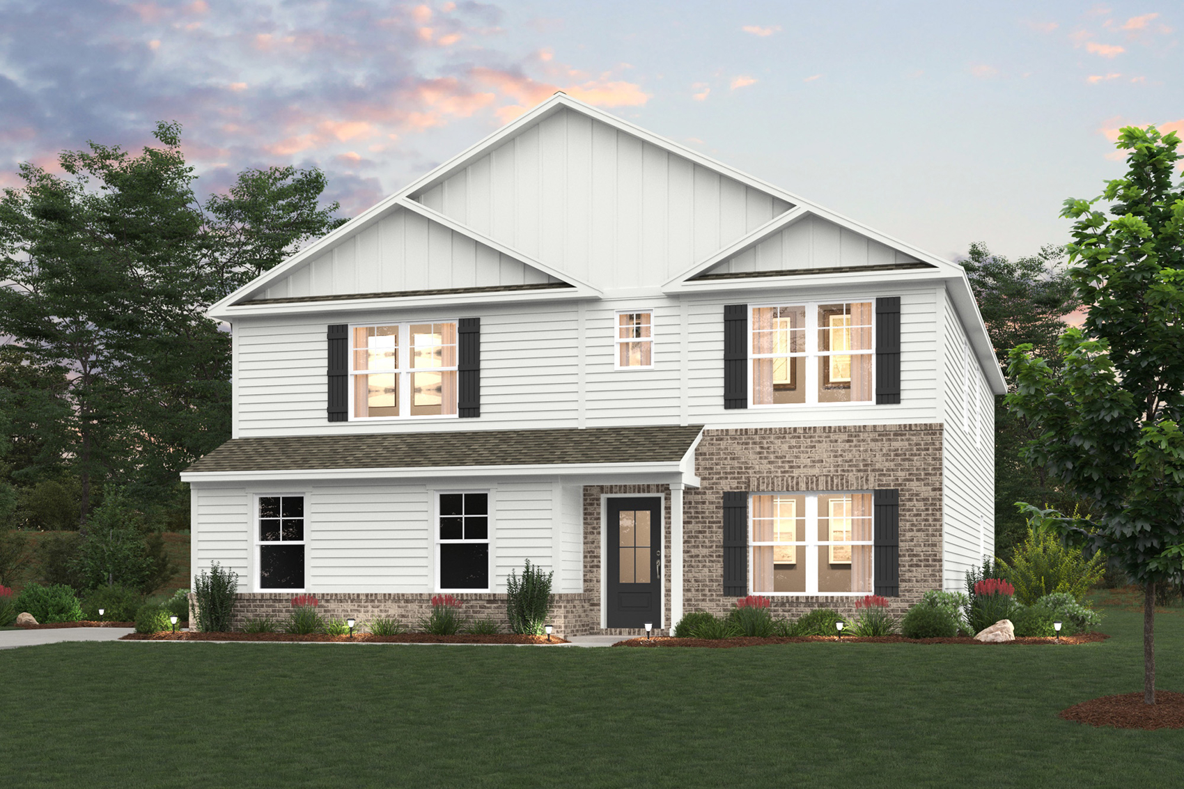 A white house with a lawn in front of it.