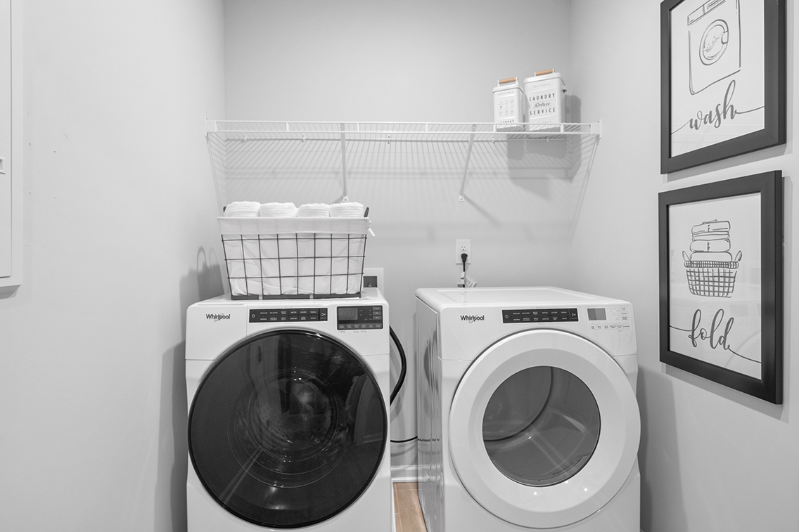 A washer and dryer in a room.