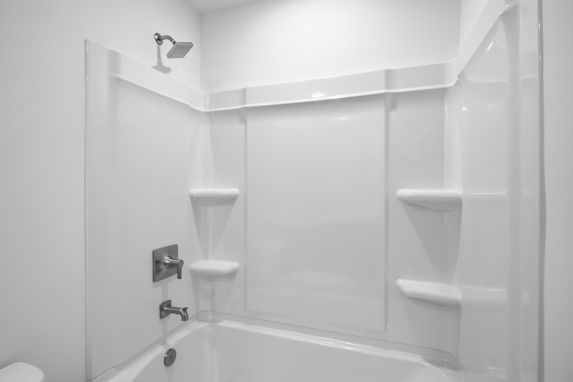 A bathroom with a glass shower.