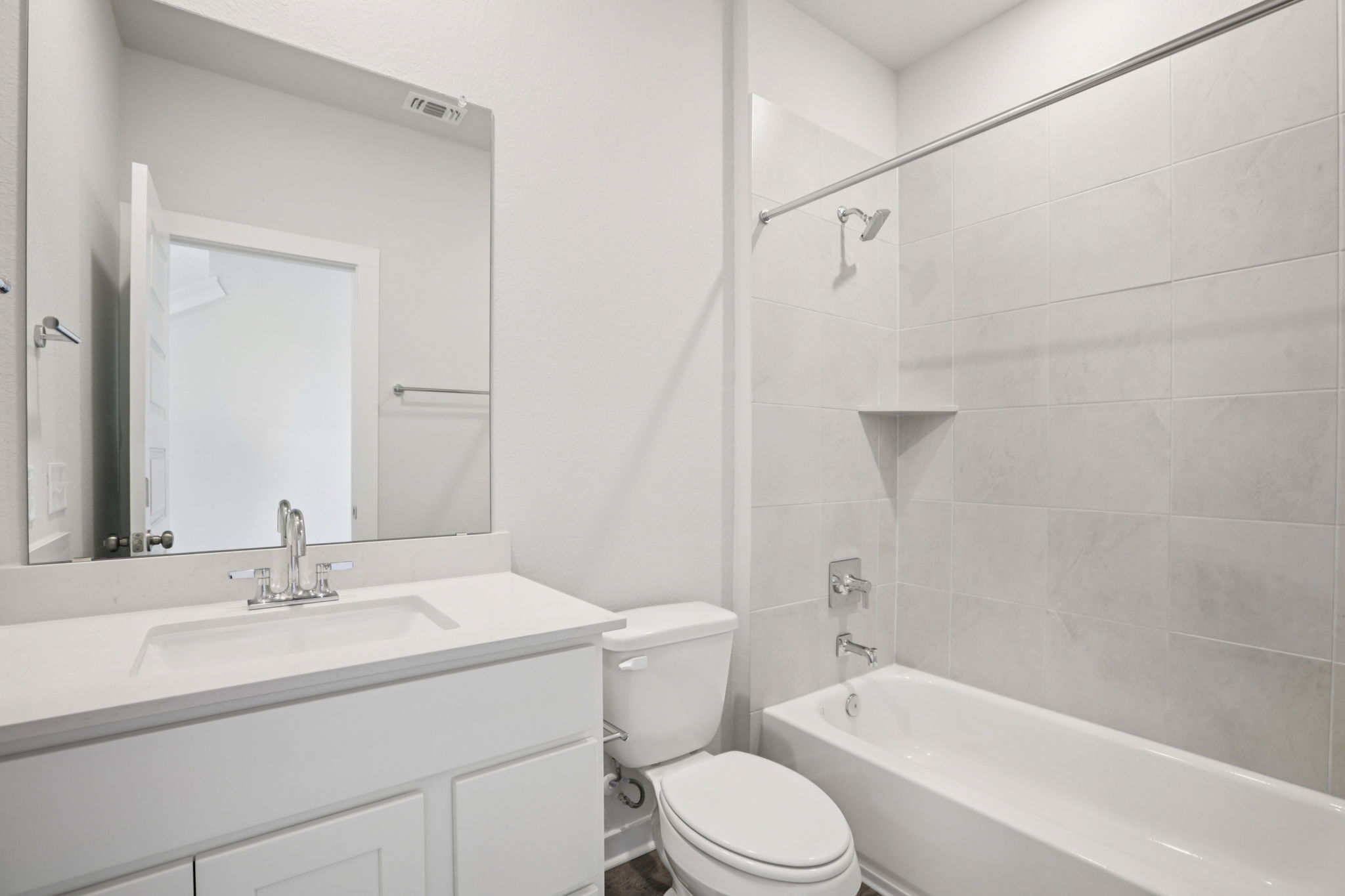 A bathroom with a toilet and sink.