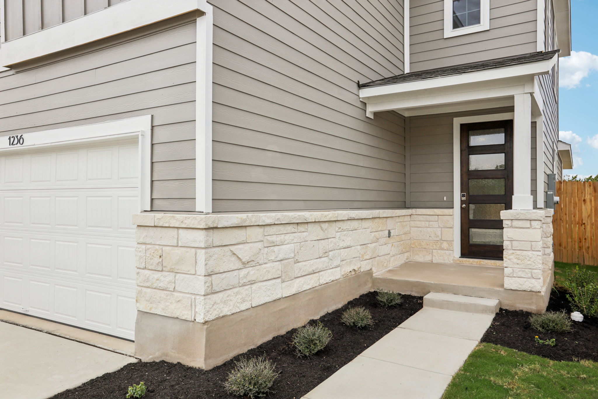 A house with a stone wall.