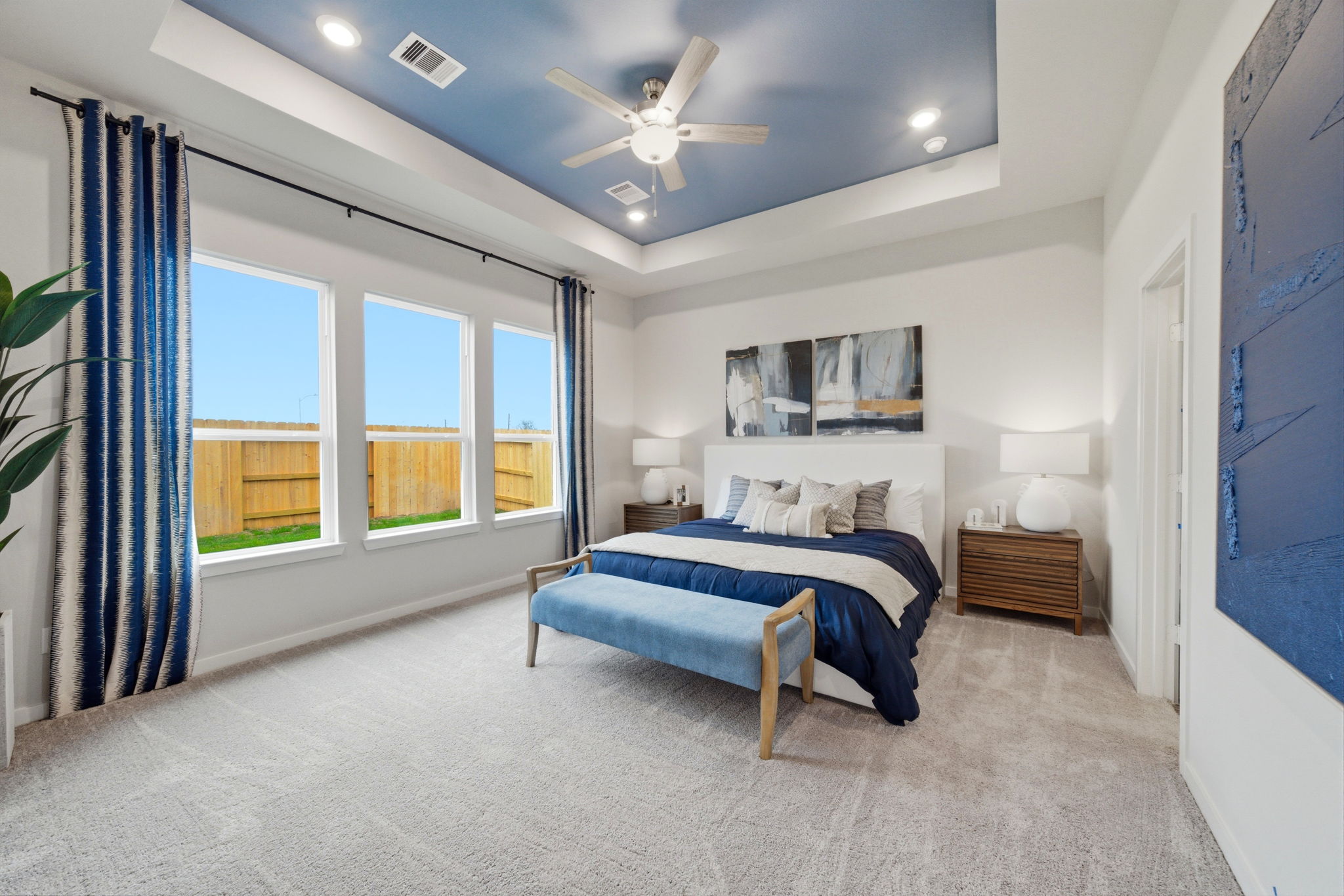 A bedroom with a bed and a window.