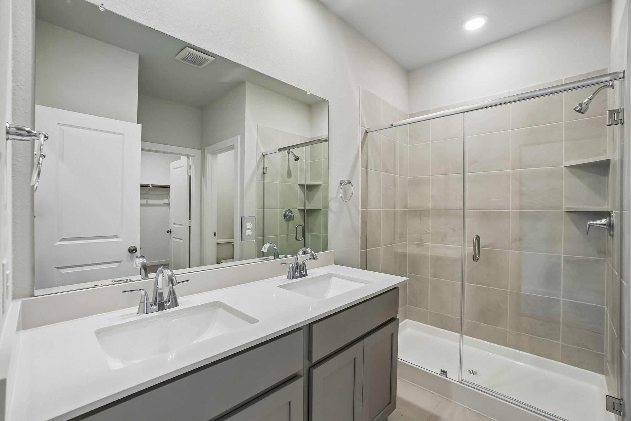 A bathroom with a glass shower.
