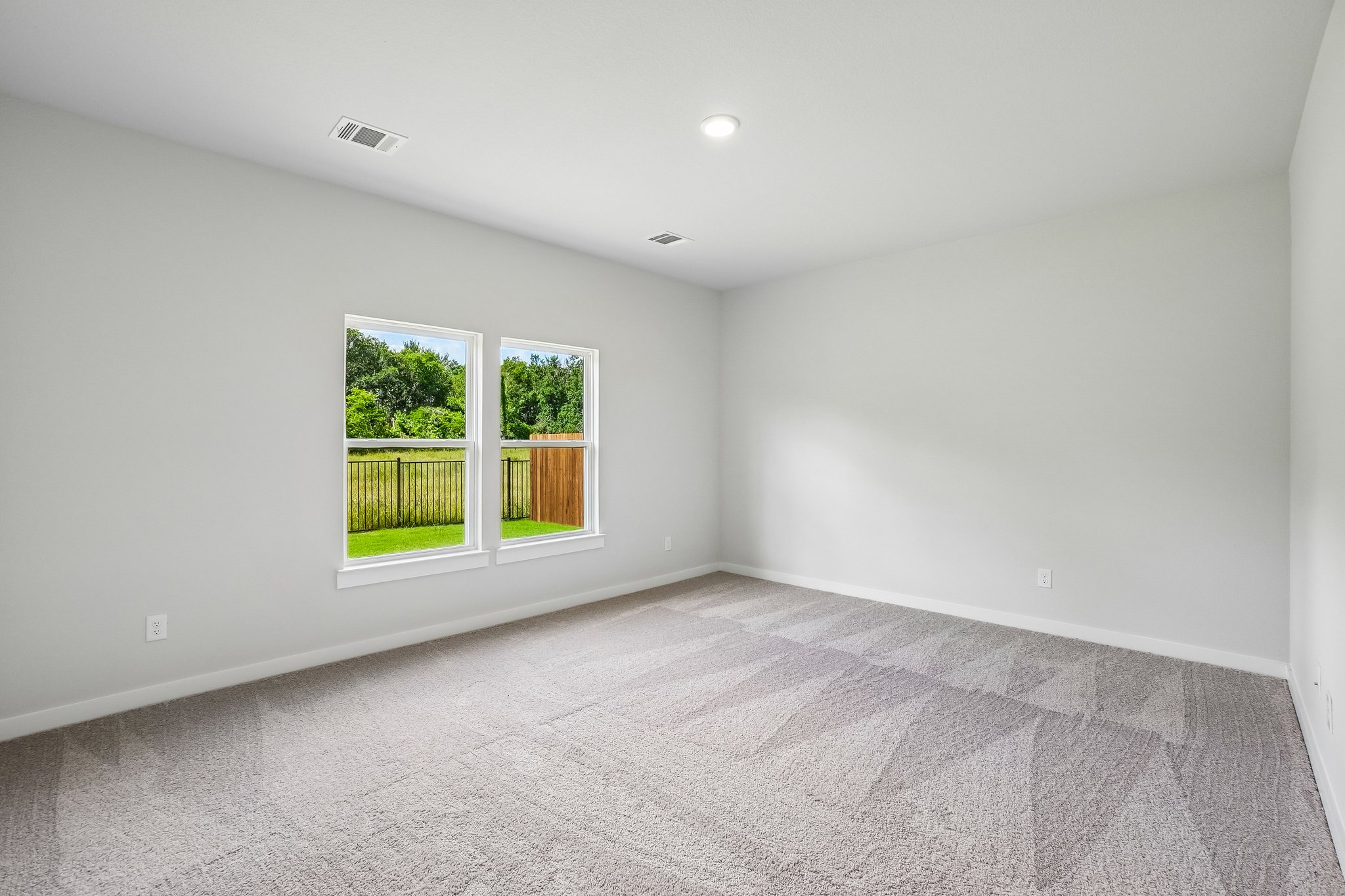 A room with a window and a door.