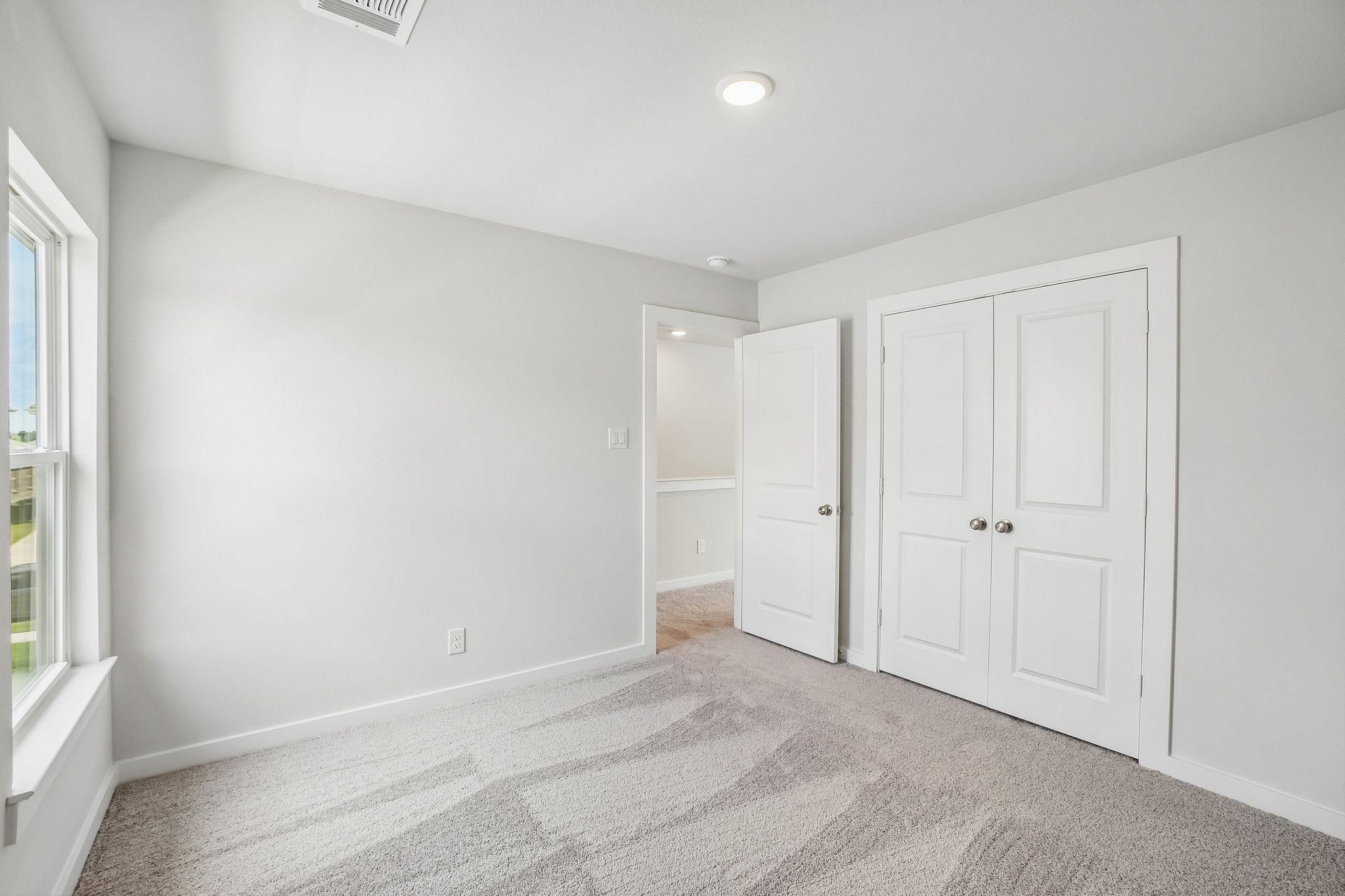 A room with white doors.